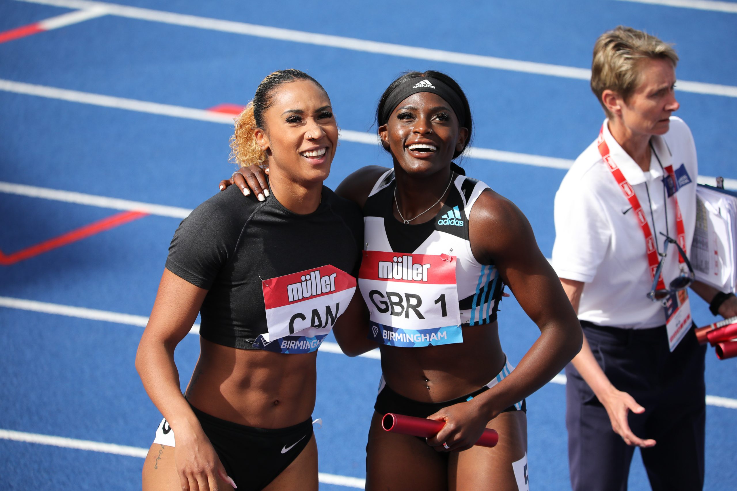 Leya Buchana and Daryll Neita embrace, womens 4x100m relay at the Alexander Stadium