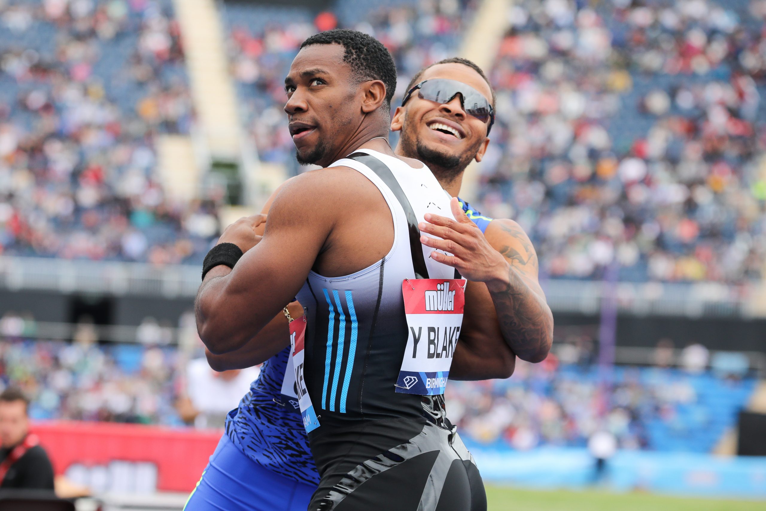 Jamaicas's Yohan Blake with Canada's Aaron Brown